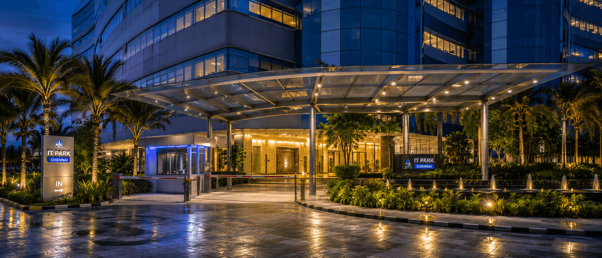 TECCI Park entrance at dusk with wet pavement reflections